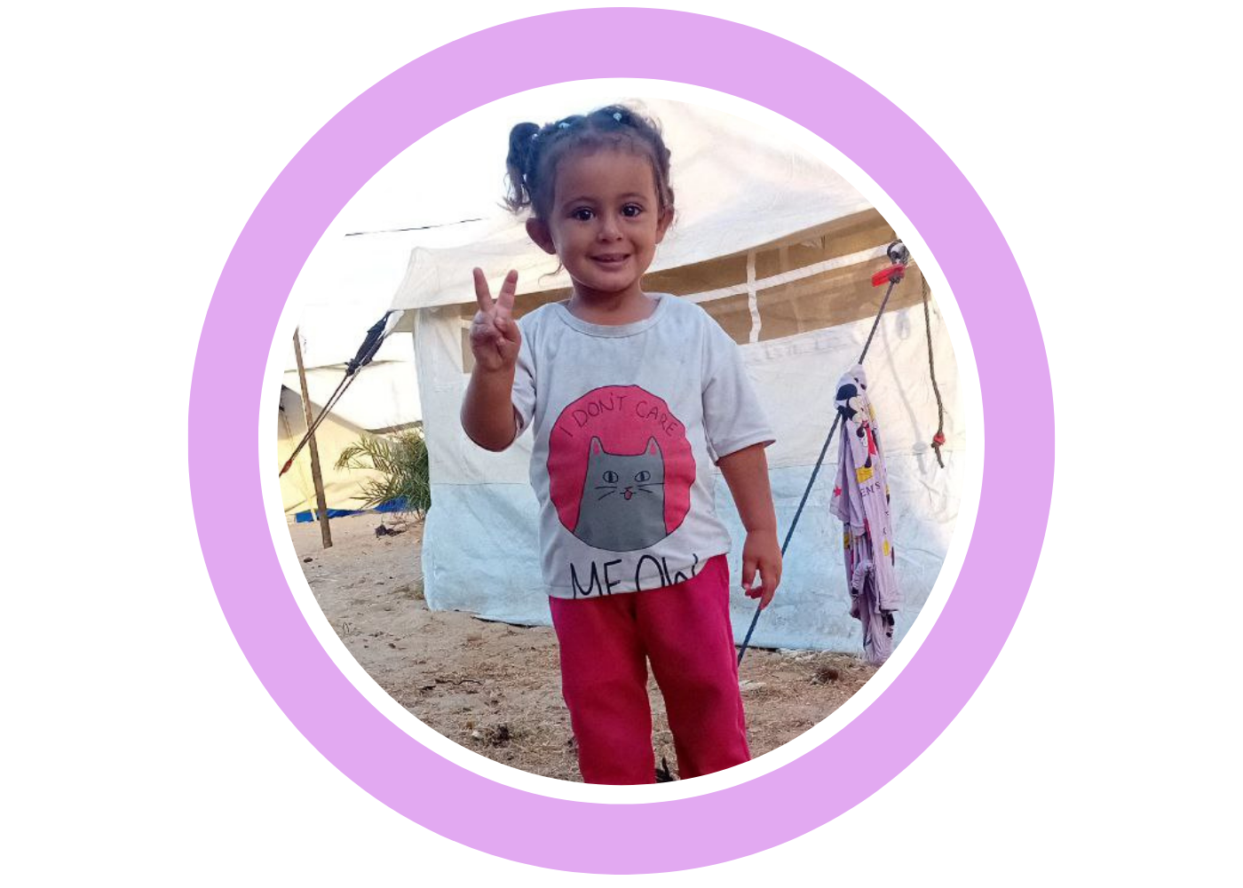 Aseel’s young child standing inside a tent