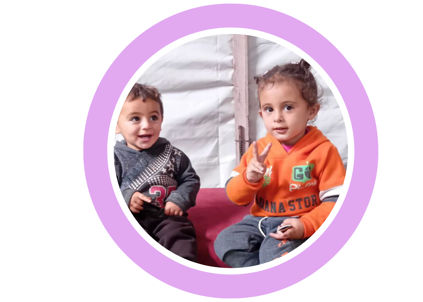 Aseel’s two young children sitting together