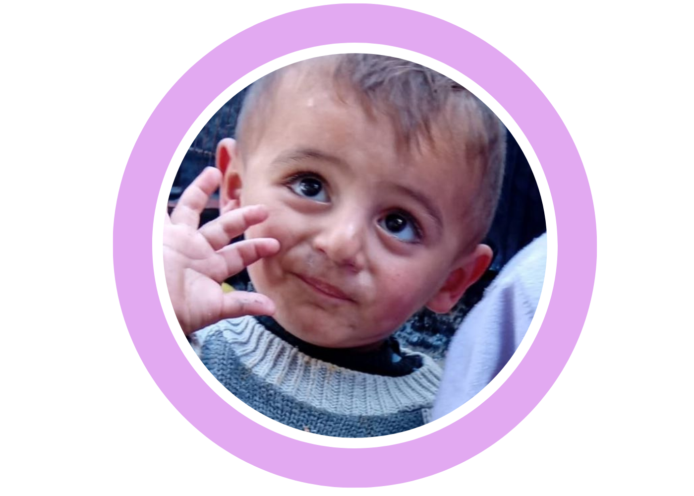 Aseel’s young child waving