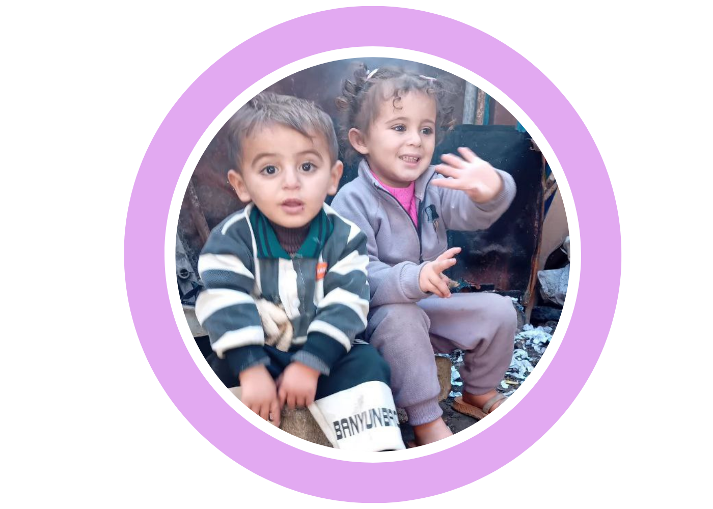 Aseel’s two children waving